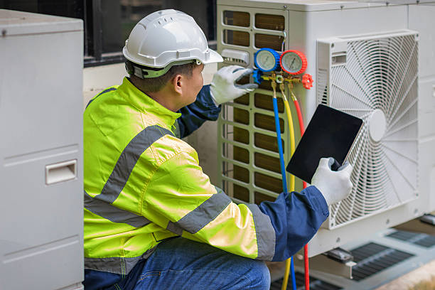 Professional Heat Pump Repair technician working in Laceys Spring, AL